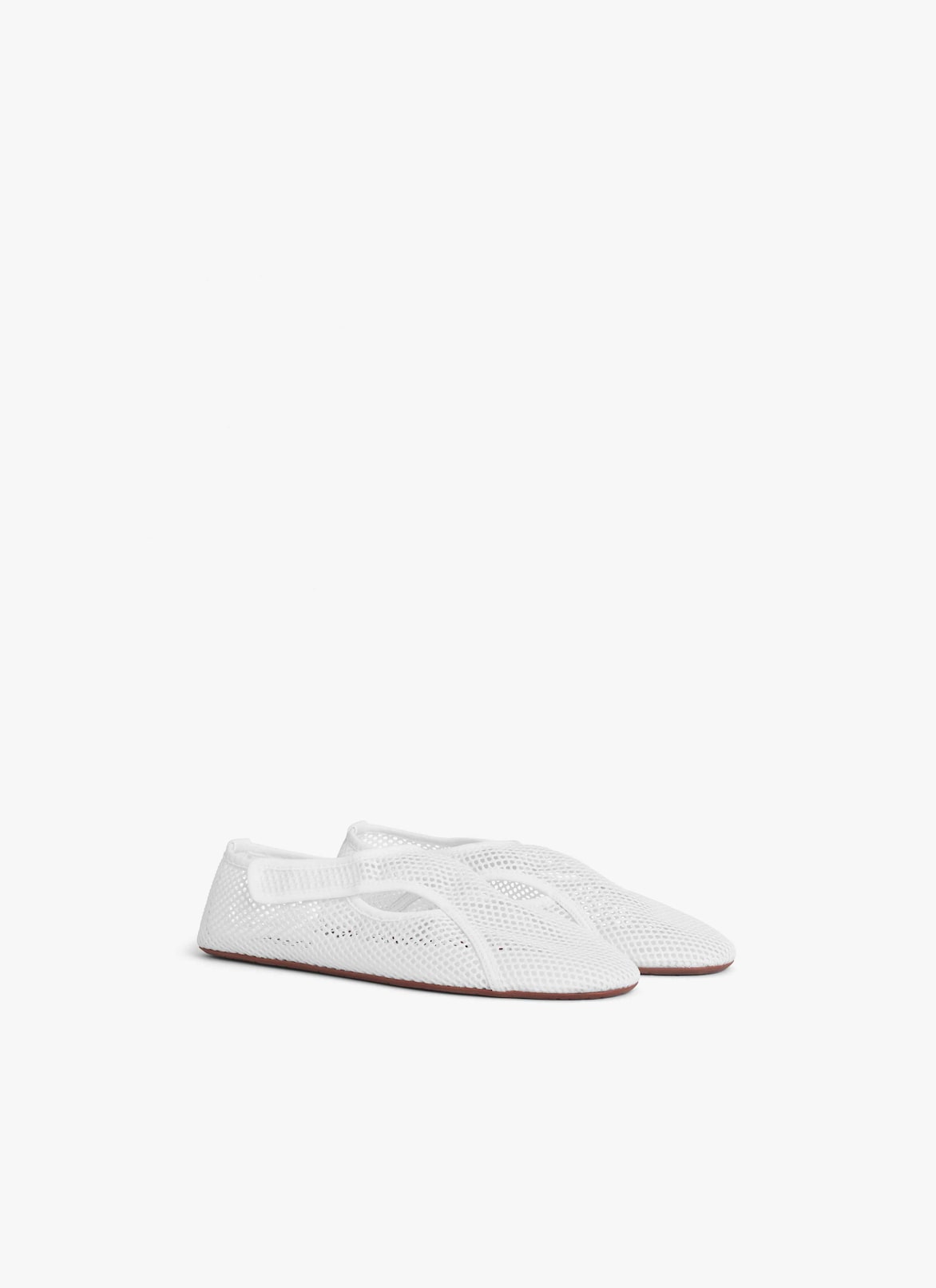 SLIPPERS IN FISHNET ALAÏA OPTIC WHITE SLIPPERS IN FISHNET